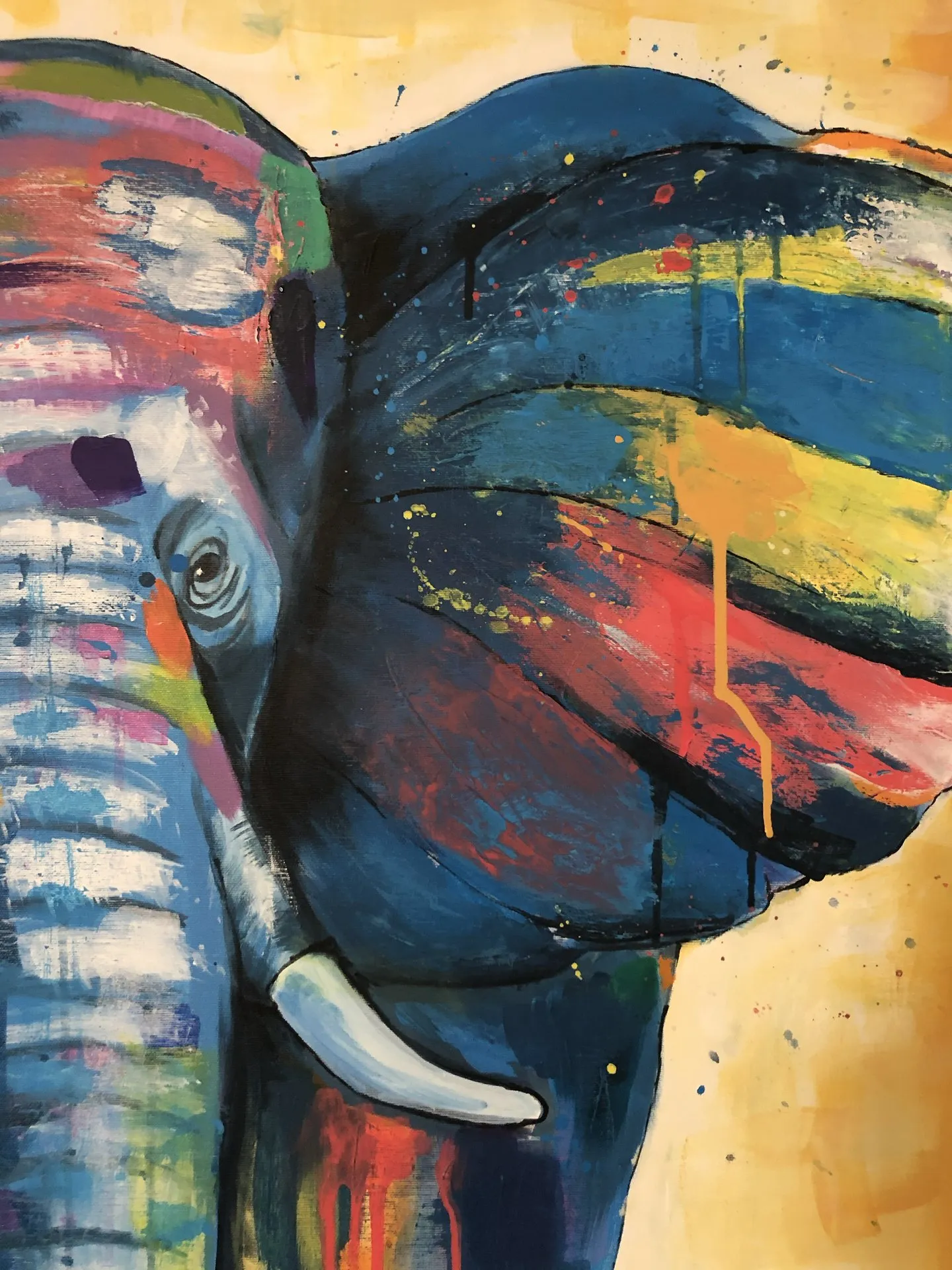 Acrylic painting of an elephant in blues, reds and yellows